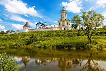 Vysotsky monastery and its reflection in the pond. Serpukhov. Moscow Region, Russia - 757954495