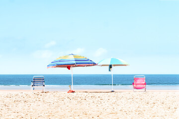 Sunny Beach Day with Colorful Umbrellas and Chairs