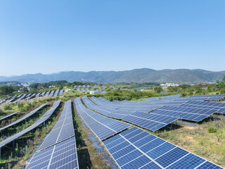aerial view of solar power station on hillside