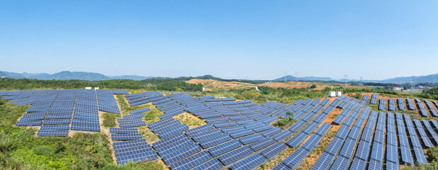 panoramic view of solar power station on hillside