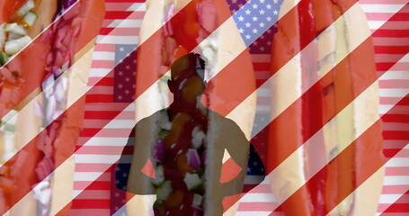 Image of white and red stripes and human silhouette over hot dogs