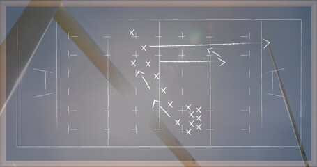 Image of drawing of game plan over rugby ball