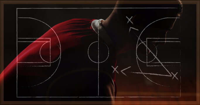 Image of drawing of game plan over biracial basketball player