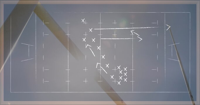 Image of drawing of game plan over rugby ball