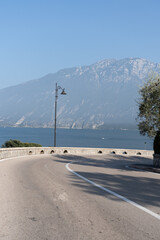 road bend on a sunny day with mountain view