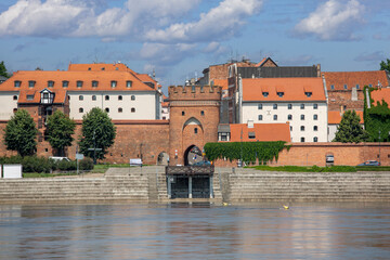 Fototapeta na wymiar Vistula River view from viewing platform of the Old Town with Bridge Gate, Torun, Poland