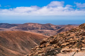 Papier Peint photo autocollant Atlantic Ocean Road Desert landscape bordering the Atlantic Ocean. Photography taken in Fuerteventura, Canary Islands, Spain.