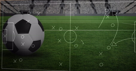 Fototapeta premium Image of drawing of game plan over stadium and football