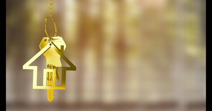 Image of keys with house keychain over blurred background