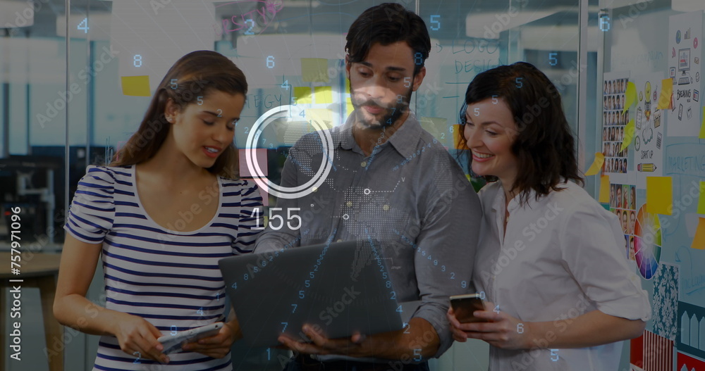 Aufkleber image of globe and data processing over diverse colleagues discussing over laptop at office