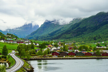 Fototapeta na wymiar Mountains and Fjord over Norwegian Village in Olden, Innvikfjorden, Norway