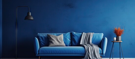 Cozy Interior Design with Blue Couch, Plush Pillows, and Illuminated Lamp