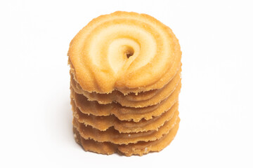 Stacked of danish butter cookies the vanilla ring cookie isolated on white background clipping path