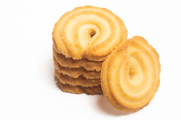 Stacked of danish butter cookies the vanilla ring cookie isolated on white background clipping path