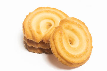 Stacked of danish butter cookies the vanilla ring cookie isolated on white background clipping path