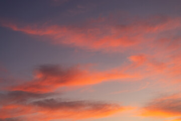 Beautiful red clouds on the sunrise sky.