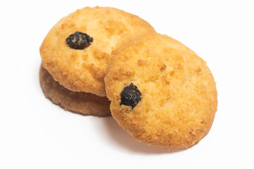 Stacked of danish butter cookies the coconut style cookie with raisin isolated on white background clipping path
