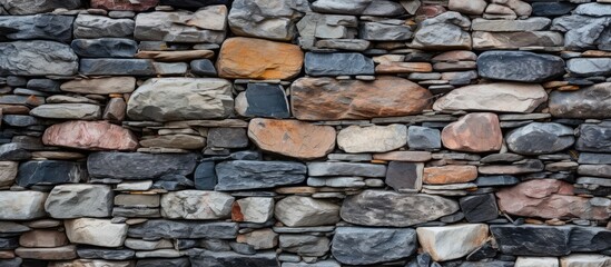Vibrant Stone Wall Featuring Striking Red and Blue Stones, Texture Background for Design Projects