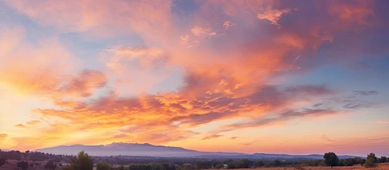 Foto op Plexiglas Vibrant Sky at Golden Hour - A Stunning Sunset Landscape Photography © Ilgun