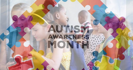 Image of autism awareness month text over diverse schoolchildren using smartphone - 757984609