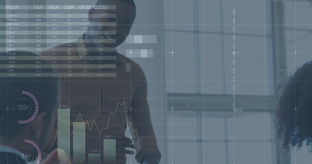 Image of financial data and graphs over diverse businesspeople talking in office