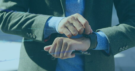 Image of data processing over biracial businessman using smartwatch