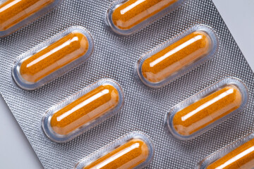 Turmeric capsules or Curcuma capsules in blister pack, medicines for health, pharmaceutical health care and sciences concept