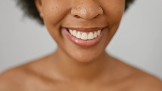 African american woman smiling on white isolated background showing happiness and confidence.
