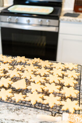 Cooling Snowflake-Shaped Sugar Cookies on a Rack