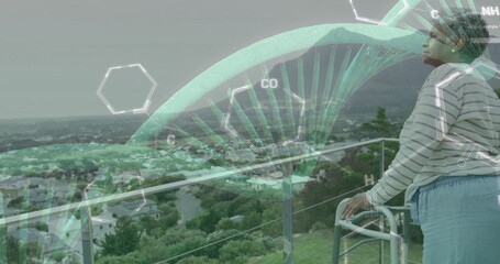 Image of dna strand and data processing over african american senior female patient