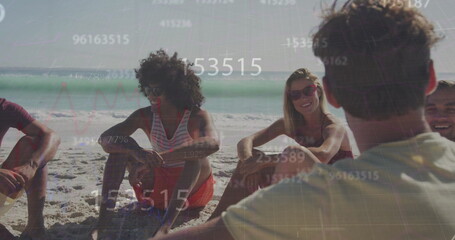 Image of numbers over diverse friends at beach