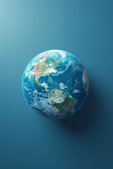 a close up of a blue earth with a shadow on a blue background