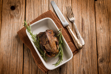 roasted pigeon with herbs over wood background - 758003436
