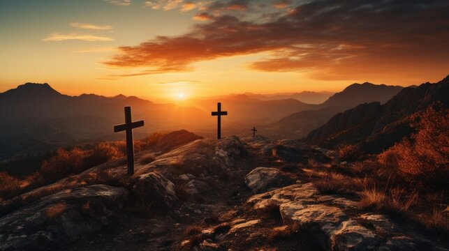 Three crosses silhouetted on a mountain peak during a vibrant sunset.