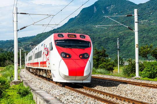 Hualien, Taiwan: July 6, 2019: Tze-Chiang Limited Express(Puyuma)  train is passing through the beautiful countryside of Hualien, Taiwan.