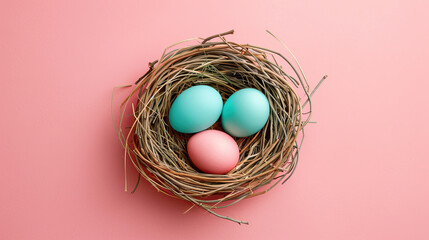 Obraz premium top view of a bird nest with three colorful eggs isolated pastel background