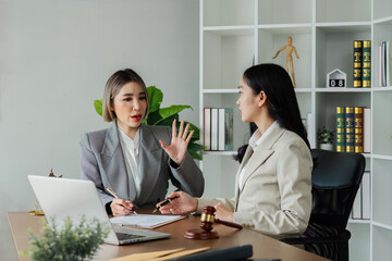 Lawyer working with client discussing contract document in office, consulting to help customer