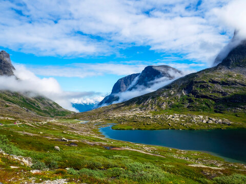 Mountains, lakes and blue sky over trollveggen Norway on a beautiful summer day