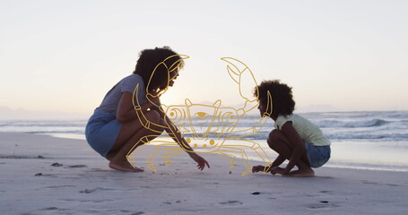 Image of cancer over african american mother and son picking up shells on beach at sunset