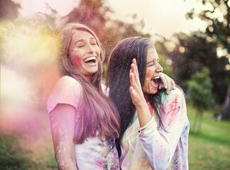 Happy, powder paint and girl friends laugh outdoor with Holi festival and colorful event with...
