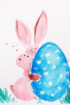 One cute pink bunny with blue egg. Happy Easter concept arts