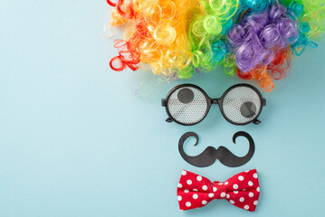 April Foolery display: top view photo with humorous goggles, buffoon's wig, neckwear, and pretend...