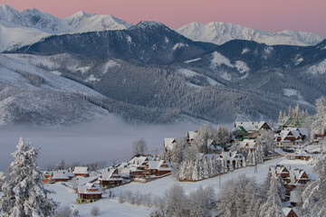 Beautiful winter morning view with mountains in the background. View of the Tatra Mountains,...