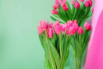 Bright spring festive background with pink tulips and a copy of the space. Bouquet of flowers.