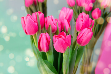 Pink tulips with golden spots on the side.