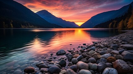 Tranquil mountain sunset with lake reflecting vibrant evening sky colors for breathtaking view