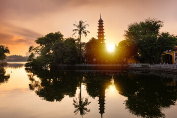 Traditional buddist pagoda on sunset in Hanoi city, Vietnam