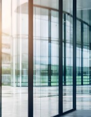 Fototapeta premium Blurred glass wall of modern business office building