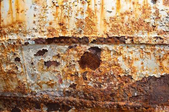 August, 2022- Rust and paint, texture from a fishing boat, on the coast in Dalmatia, Croatia, EU