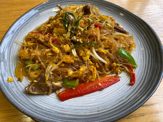 Fried vermicelli in a plate on the table